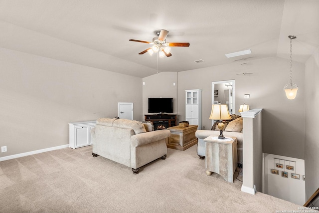living room with a ceiling fan, baseboards, light colored carpet, lofted ceiling, and visible vents