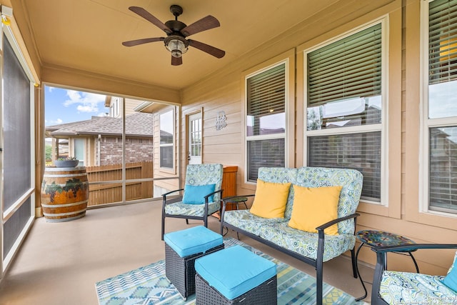 sunroom / solarium with a wealth of natural light and a ceiling fan