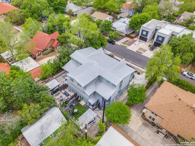 birds eye view of property with a residential view