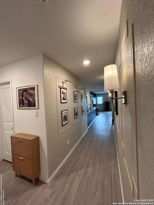 5936 Forenoon, Bulverde, TX 78163 - hall with baseboards, recessed lighting, wood finished floors, and a textured wall