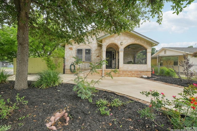 1923 W Pyron Ave, San Antonio, TX 78211 - view of front of property with fence and stone siding