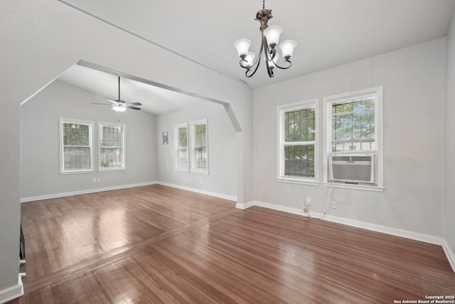 1923 W Pyron Ave, San Antonio, TX 78211 - spare room with ceiling fan with notable chandelier, cooling unit, wood finished floors, and a wealth of natural light