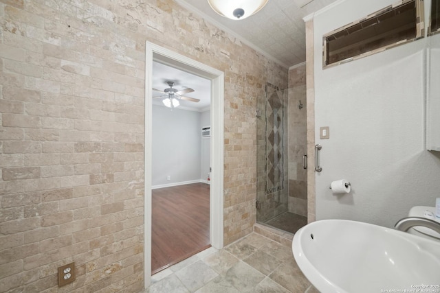 1923 W Pyron Ave, San Antonio, TX 78211 - full bath with crown molding, a sink, a stall shower, baseboards, and a ceiling fan