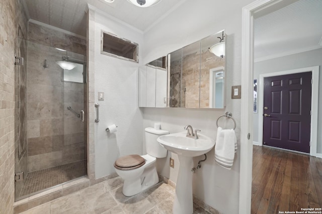 1923 W Pyron Ave, San Antonio, TX 78211 - bathroom with toilet, a shower stall, crown molding, and baseboards