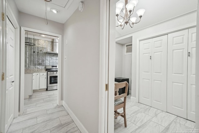 1923 W Pyron Ave, San Antonio, TX 78211 - hall with a wall unit AC, a chandelier, baseboards, attic access, and marble finish floor