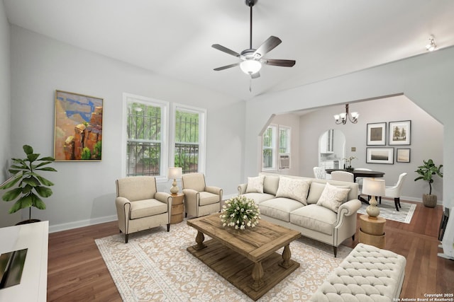 1923 W Pyron Ave, San Antonio, TX 78211 - living area featuring lofted ceiling, ceiling fan with notable chandelier, wood finished floors, and baseboards