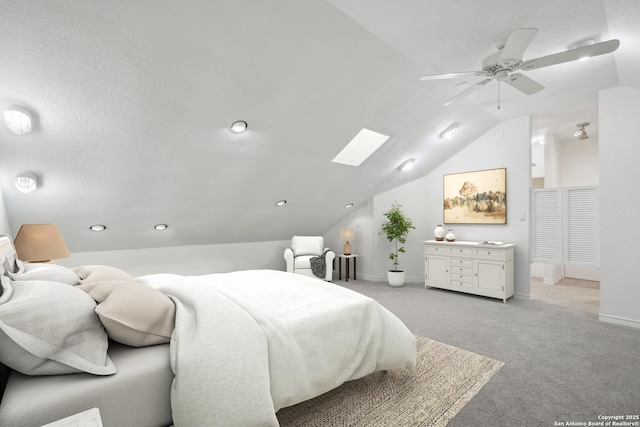 1923 W Pyron Ave, San Antonio, TX 78211 - bedroom with baseboards, a ceiling fan, vaulted ceiling with skylight, and light colored carpet