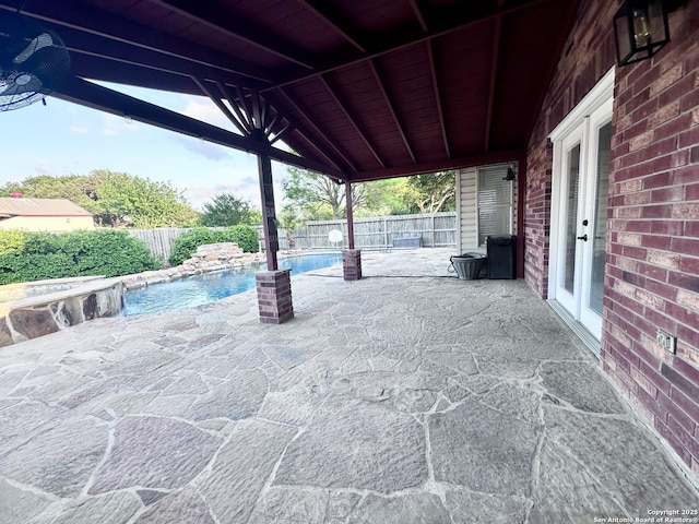 view of patio / terrace featuring a fenced backyard and a fenced in pool