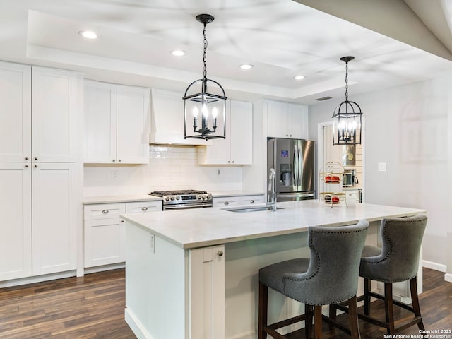 106 Castleoaks Dr, San Antonio, TX 78213 - kitchen featuring dark wood-style floors, stainless steel appliances, a notable chandelier, and a sink
