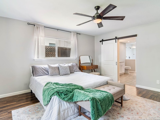 106 Castleoaks Dr, San Antonio, TX 78213 - bedroom featuring wood finished floors, a barn door, ceiling fan, and baseboards