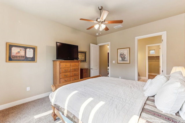 carpeted bedroom featuring ceiling fan, baseboards, and visible vents