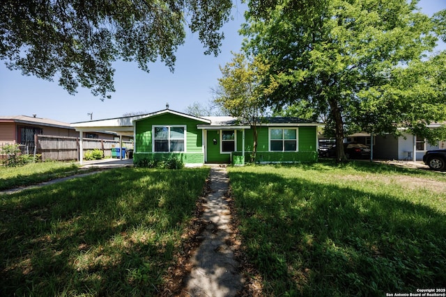 single story home featuring fence