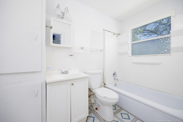 bathroom with tub / shower combination, toilet, and vanity