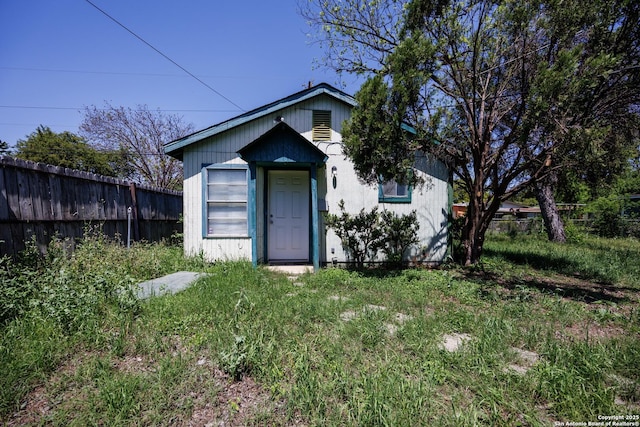 view of outdoor structure with fence