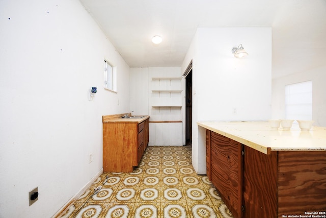 bathroom with baseboards and vanity