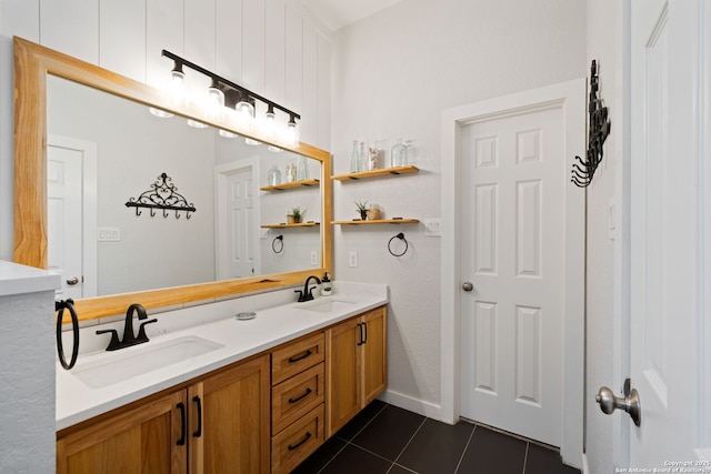 full bathroom featuring tile patterned floors, a sink, and double vanity