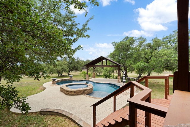 view of pool featuring a lawn, a gazebo, a patio area, and a pool with connected hot tub