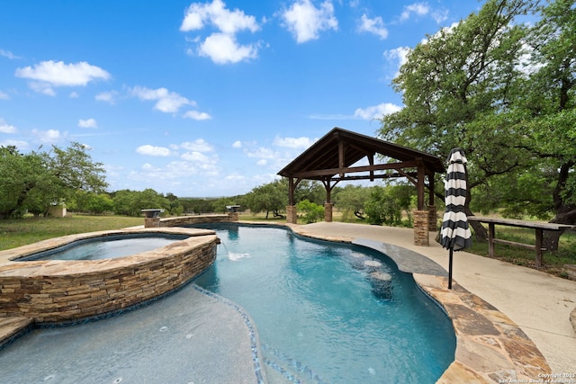 view of swimming pool featuring a gazebo, a patio, and a pool with connected hot tub