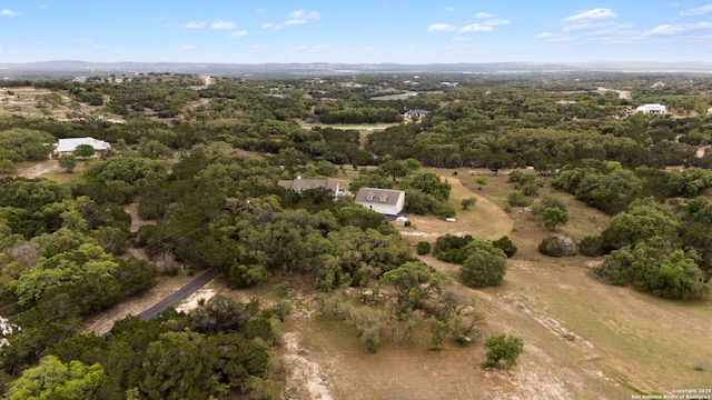 drone / aerial view with a view of trees