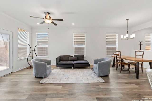 8212 Mulaney, San Antonio, TX 78253 - living room with recessed lighting, wood finished floors, crown molding, baseboards, and ceiling fan with notable chandelier