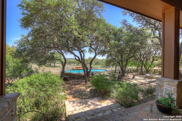 view of yard featuring an outdoor pool
