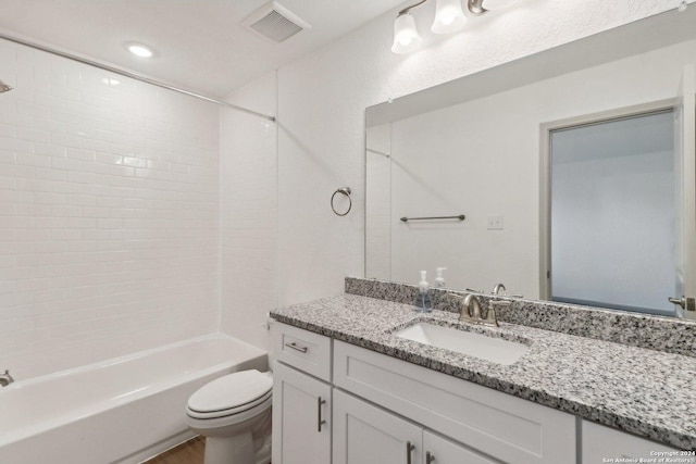 full bath featuring toilet, shower / bathing tub combination, visible vents, wood finished floors, and vanity