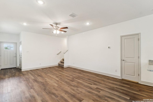 unfurnished living room with recessed lighting, dark wood finished floors, stairway, visible vents, and a ceiling fan