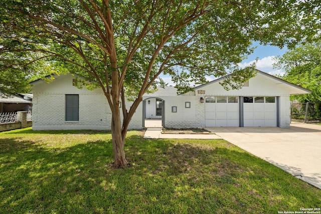 5822 Bennington, San Antonio, TX 78228 - view of front facade with a front lawn, concrete driveway, fence, brick siding, and an attached garage