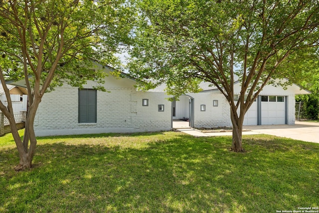 5822 Bennington, San Antonio, TX 78228 - view of front of property featuring a garage, a front lawn, brick siding, and concrete driveway