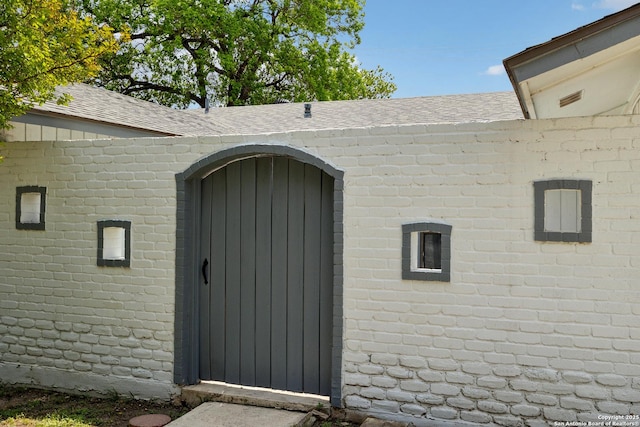 5822 Bennington, San Antonio, TX 78228 - property entrance with brick siding and a shingled roof