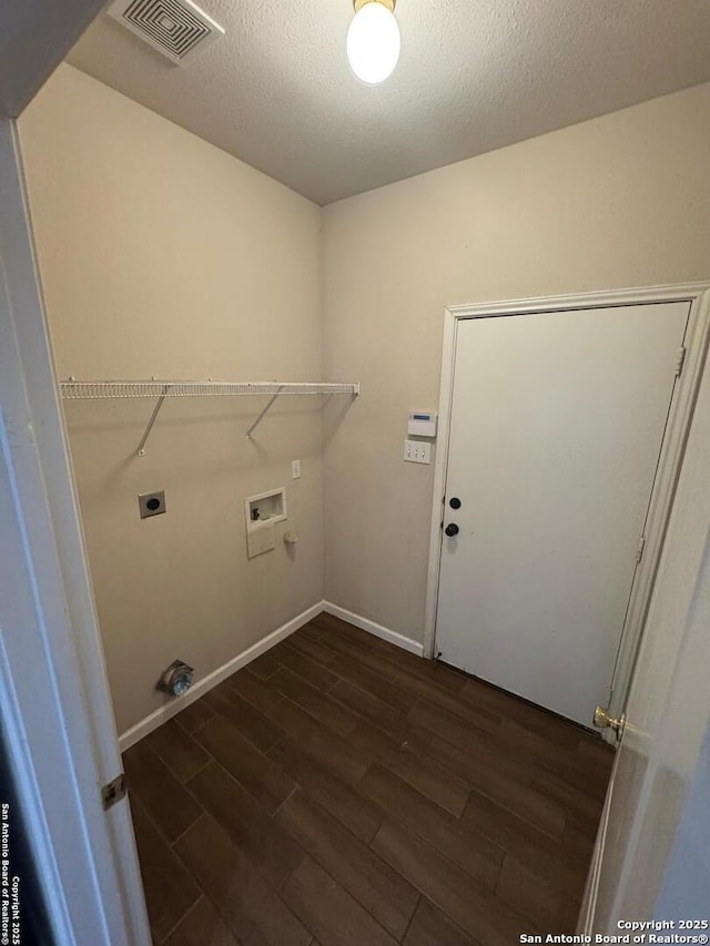 791 Sycamore Moon, San Antonio, TX 78216 - laundry room featuring dark wood-style flooring, laundry area, electric dryer hookup, and visible vents