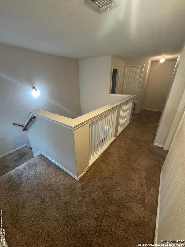 791 Sycamore Moon, San Antonio, TX 78216 - hall featuring carpet floors, an upstairs landing, visible vents, and baseboards