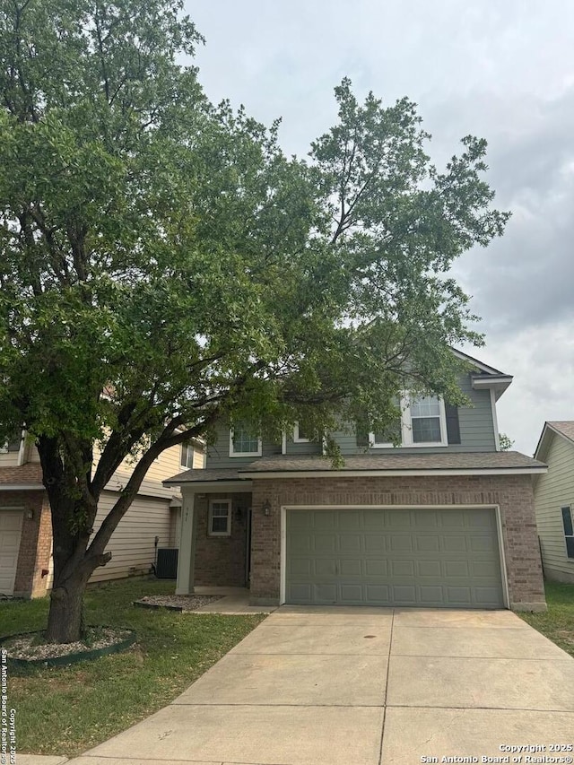 791 Sycamore Moon, San Antonio, TX 78216 - view of front of home with brick siding, driveway, and a garage