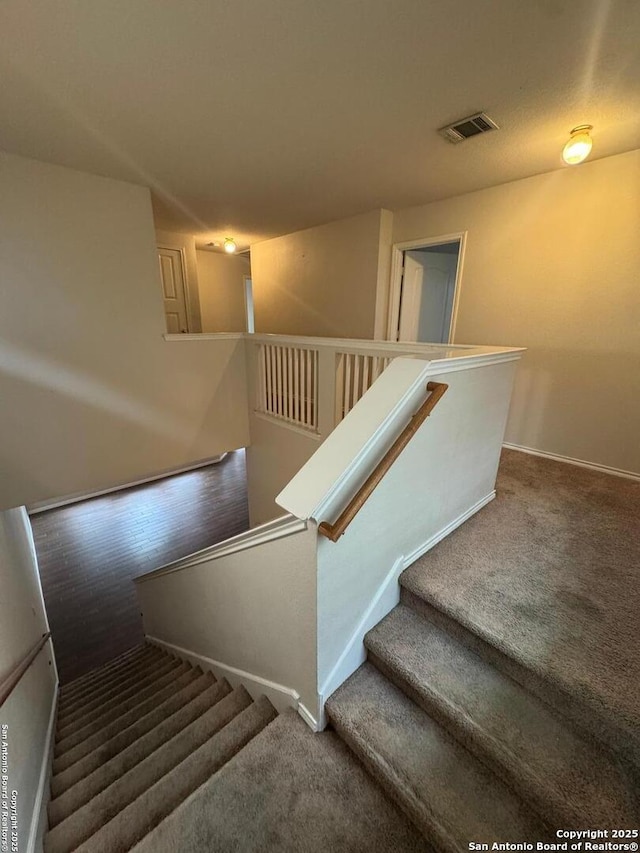 791 Sycamore Moon, San Antonio, TX 78216 - stairs featuring carpet, visible vents, and baseboards