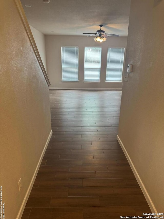 791 Sycamore Moon, San Antonio, TX 78216 - hall featuring a healthy amount of sunlight, baseboards, and dark wood-style flooring