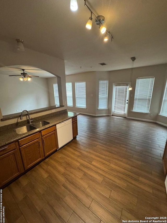791 Sycamore Moon, San Antonio, TX 78216 - kitchen with a sink, open floor plan, white dishwasher, brown cabinets, and ceiling fan