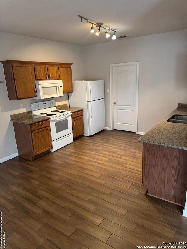 791 Sycamore Moon, San Antonio, TX 78216 - kitchen with a sink, brown cabinets, white appliances, dark wood-type flooring, and visible vents