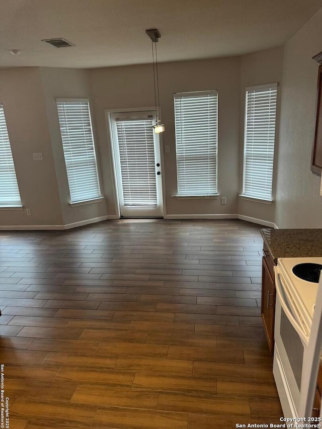 791 Sycamore Moon, San Antonio, TX 78216 - unfurnished dining area featuring baseboards, visible vents, and dark wood finished floors