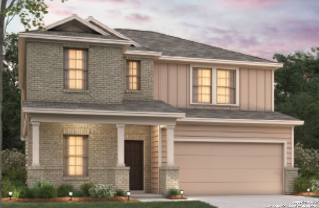 view of front facade featuring an attached garage, board and batten siding, and concrete driveway