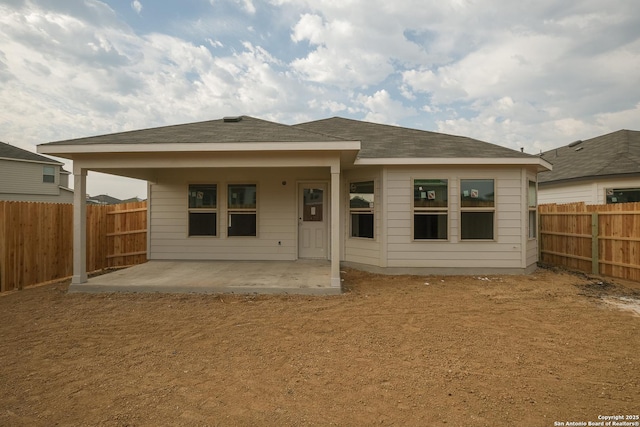 5915 Caliche Fls, San Antonio, TX 78222 - back of property with a patio area and a fenced backyard