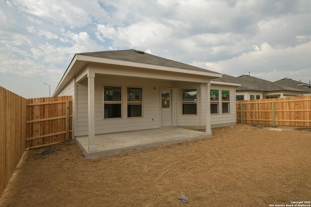 5915 Caliche Fls, San Antonio, TX 78222 - rear view of property with a patio area and a fenced backyard