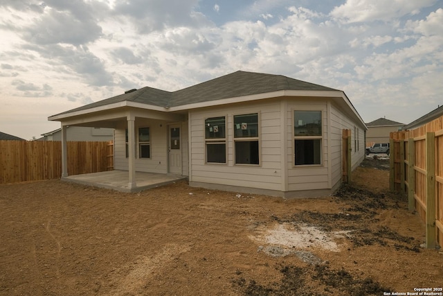 5915 Caliche Fls, San Antonio, TX 78222 - back of house featuring a patio area and a fenced backyard