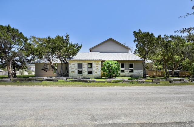 1340 Hinch, New Braunfels, TX 78132 - view of front of house featuring stone siding and metal roof