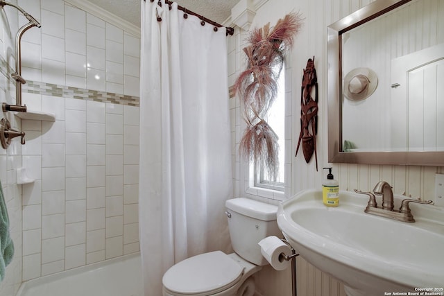 1340 Hinch, New Braunfels, TX 78132 - full bathroom with shower / bath combo, toilet, a sink, and a textured ceiling