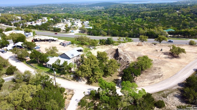 1340 Hinch, New Braunfels, TX 78132 - drone / aerial view featuring a wooded view