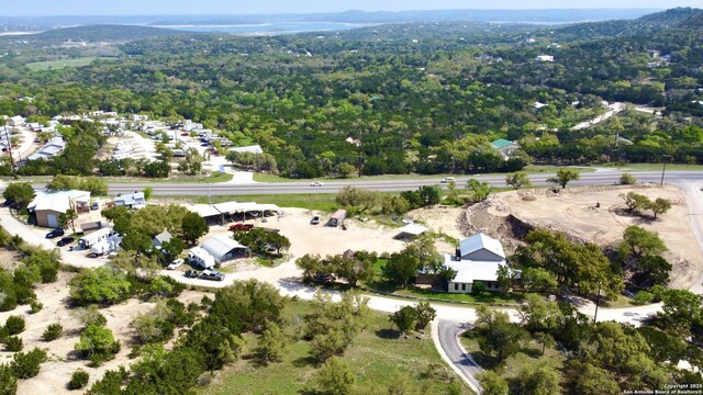 1340 Hinch, New Braunfels, TX 78132 - drone / aerial view with a wooded view