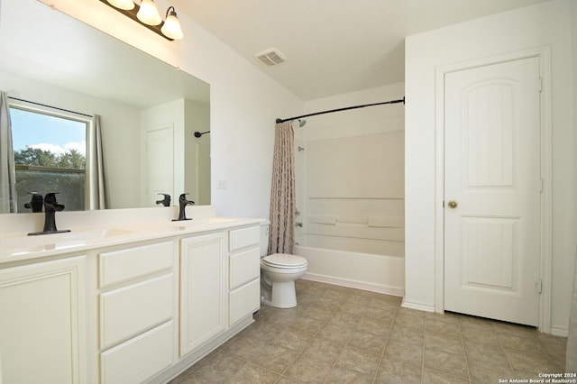 bathroom with toilet, a sink, visible vents, and double vanity