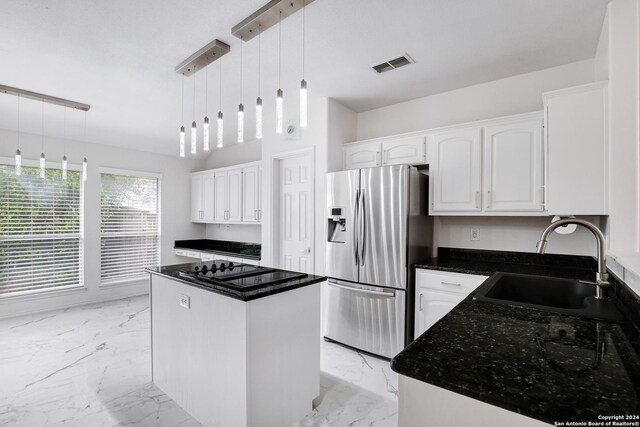 kitchen with stainless steel refrigerator with ice dispenser, visible vents, a sink, and marble finish floor