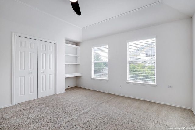 unfurnished bedroom featuring ceiling fan, baseboards, carpet flooring, and a closet