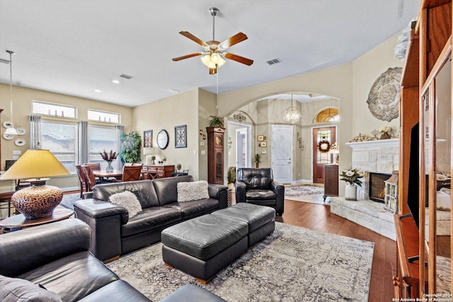 534 Mission Hill Run, New Braunfels, TX 78132 - living room with arched walkways, hardwood / wood-style floors, visible vents, and ceiling fan